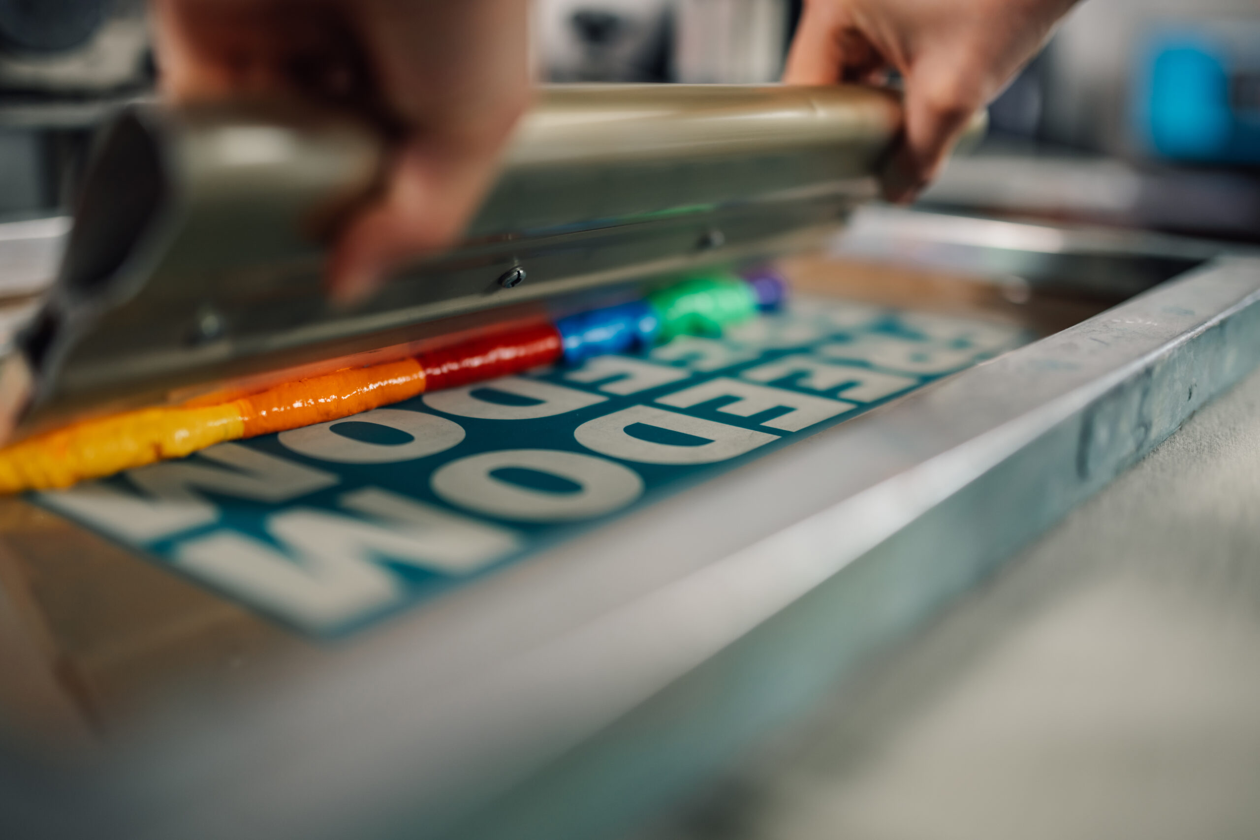 close up of squeegee with ink on silkscreen printi 2024 05 15 14 59 51 utc scaled